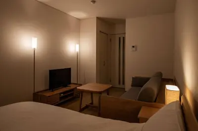 a hotel room with a bed and a couch and a television at Noah Ikebukuro / Vacation STAY 7298 in Tokyo