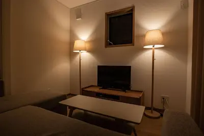 a living room with two lamps and a flat screen tv at Noah Ikebukuro / Vacation STAY 7296 in Tokyo