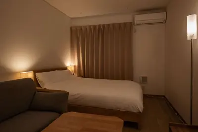 a hotel room with a bed and a couch at Noah Ikebukuro / Vacation STAY 7295 in Tokyo