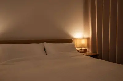 a bedroom with a white bed and a lamp at Noah Ikebukuro / Vacation STAY 7295 in Tokyo