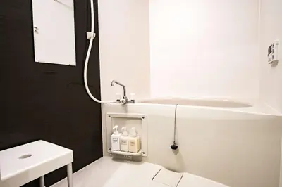 a white bathroom with a sink and a shower at Noah Ikebukuro / Vacation STAY 7295 in Tokyo