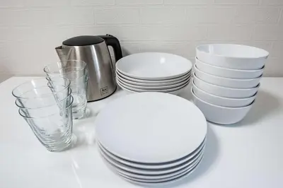 a group of plates and glasses on a table at Noah Ikebukuro / Vacation STAY 7294 in Tokyo