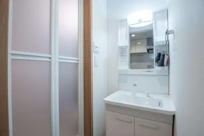a white bathroom with a sink and a mirror at Noah Ikebukuro / Vacation STAY 7294 in Tokyo