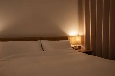a bedroom with a white bed and a lamp at Noah Ikebukuro / Vacation STAY 7294 in Tokyo