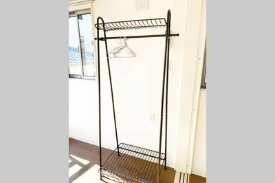 a metal shelf in a room with a window at SunStay - Tachiaigawa 1 in Tokyo