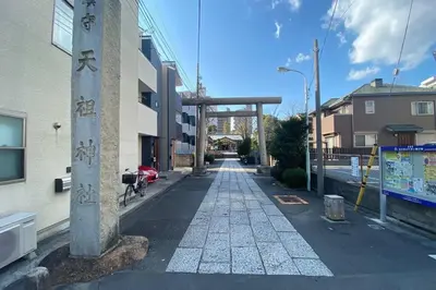 an empty street with a stone walkway between buildings at SunStay - Tachiaigawa 1 in Tokyo
