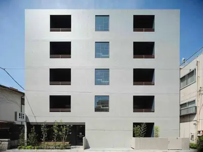 a white building with windows on the side of it at East SQUARE Tokyo in Tokyo