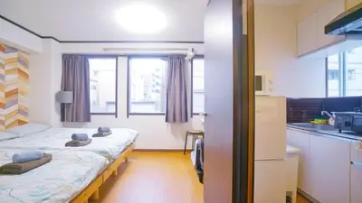 a small room with two beds in a kitchen at TOKYO ICHIBAN ASAKUSA in Tokyo
