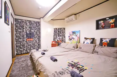 a bedroom with a large bed with weapons on it at TOKYO ICHIBAN ASAKUSA in Tokyo