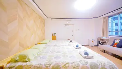 a bedroom with a large bed in a room at TOKYO ICHIBAN ASAKUSA in Tokyo