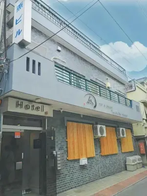 a building with a balcony on top of it at Tsubame Hotel Asakusabashi 3 minutes walk from Asakusabashi Station Near Asakusa, Akihabara, and Ueno Cooking utensils and kitchen washing machine available Direct access to Haneda and Narita airports in Tokyo