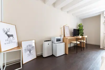 a room with two refrigerators and a microwave at LUANAHOTEL IN NAKANO in Tokyo