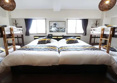 a bedroom with two beds and two windows at Taito-ku - Apartment / Vacation STAY 80790 in Tokyo