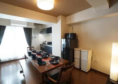 a room with a dining table and a kitchen at Taito-ku - Apartment / Vacation STAY 80790 in Tokyo