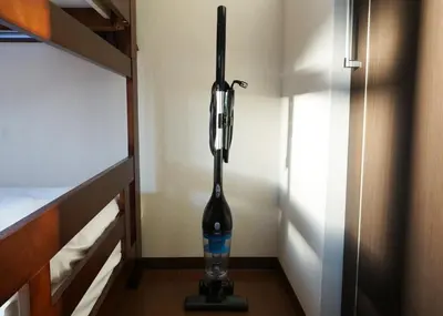a vacuum in a room next to a bunk bed at Taito-ku - Apartment / Vacation STAY 80790 in Tokyo
