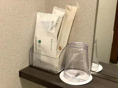 a glass vase sitting on a shelf in a room at Hotel Kazusaya in Tokyo