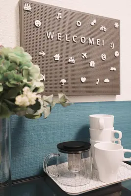 a glass table with a welcome sign on a wall at Miyako Shinjuku Hotel \u90fd-\u65b0\u5bbf- in Tokyo