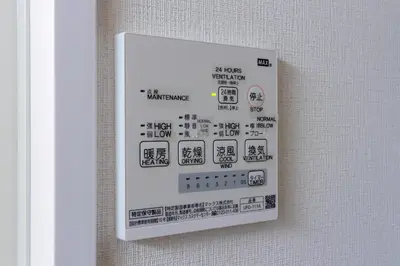 a sign on a wall with asian writing on it at Home Sweet Office Heiwajima in Tokyo