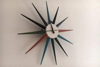 a clock is hanging on a wall at \u30a2\u30f3\u30c9\u30b9\u30c6\u30a4\u6cbc\u888b in Tokyo