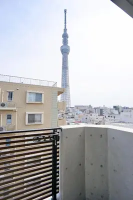 a balcony with a view of the eiffel tower at Jeffery Skytree Residence Tokyo in Tokyo