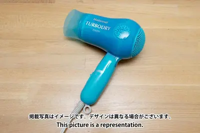 a blue blow dryer sitting on a wooden floor at Elm\u9ad8\u7530\u99ac\u5834 in Tokyo