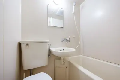 a bathroom with a toilet and a sink and a bath tub at Elm\u9ad8\u7530\u99ac\u5834 in Tokyo
