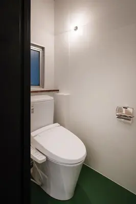 a bathroom with a white toilet and a window at Mochida Hall 1F / Vacation STAY 80337 in Tokyo