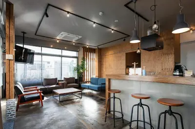a living room with a bar and a couch at Mochida Hall 1F / Vacation STAY 80337 in Tokyo