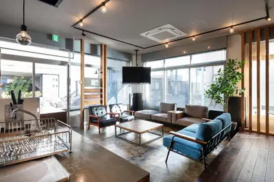 a living room with a couch and a tv at Mochida Hall 1F / Vacation STAY 80337 in Tokyo