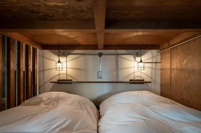 a bedroom with two white beds and two lights at Mochida Hall 1F / Vacation STAY 80337 in Tokyo