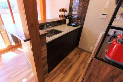 a kitchen with a sink and a wooden floor at Sumida-ku - House / Vacation STAY 80877 in Tokyo