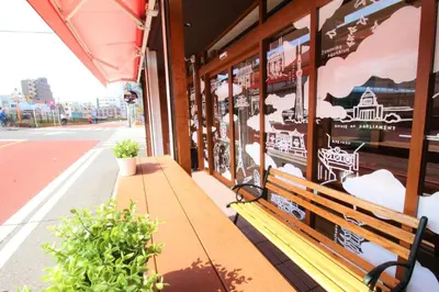 a wooden bench sitting outside of a building at Sumida-ku - House / Vacation STAY 80877 in Tokyo