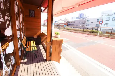 a bench sitting on the porch of a building at Sumida-ku - House / Vacation STAY 80877 in Tokyo