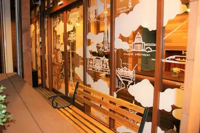 a bench sitting in front of a store window at Sumida-ku - House / Vacation STAY 80877 in Tokyo