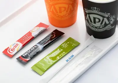 a table with toothbrushes toothpaste and a bottle of soda at APA Hotel Higashi Shinjuku Kabukicho Tower in Tokyo