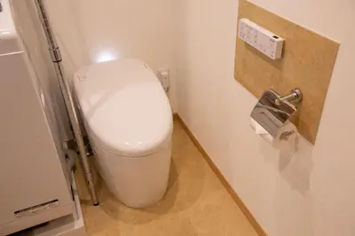 a bathroom with a white toilet in a stall at NIYS apartments 04 type in Tokyo