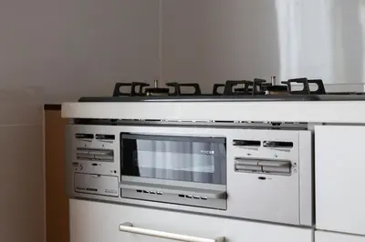 a stove with four burners on top of it at NIYS apartments 04 type in Tokyo