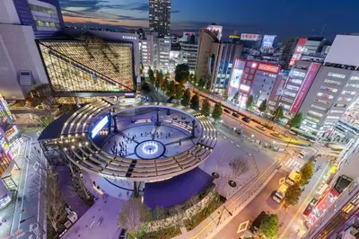 a view of a building in a city at night at Tabist Hotel Aurora Ikebukuro in Tokyo