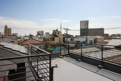 a view of a city from the roof of a building at \u58a8\u75304\u4e01\u76ee in Tokyo