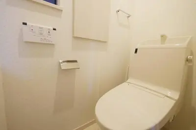 a bathroom with a white toilet in a room at \u30a2\u30f3\u30c9\u30b9\u30c6\u30a4\u9ad8\u78022\u4e01\u76ee in Tokyo