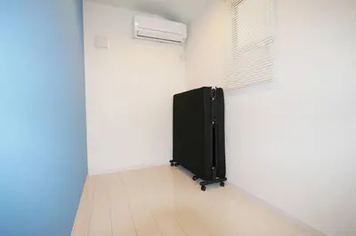 a room with a black refrigerator and a window at \u30a2\u30f3\u30c9\u30b9\u30c6\u30a4\u9ad8\u78022\u4e01\u76ee in Tokyo