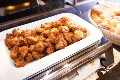 a plate of food on top of a counter at Super Hotel JR Ueno Iriyaguchi in Tokyo