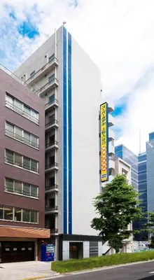 a building with a sign on the side of it at Super Hotel JR Ueno Iriyaguchi in Tokyo
