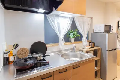 a kitchen with a sink and a stove top oven at My Home in Tokyo in Tokyo