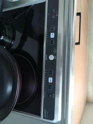 a close up of a microwave oven with a camera at My Home in Tokyo in Tokyo