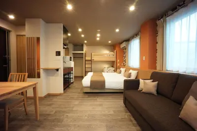 a hotel room with a bed and a couch at WIRES HOTEL James zaka in Tokyo