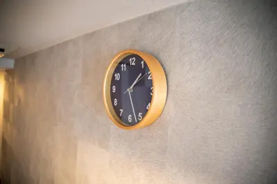 a clock on a wall on a wall at Vail sta Takenotsuka in Tokyo