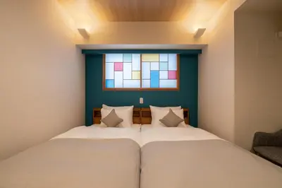 a bedroom with a bed and a window at Stay SAKURA Tokyo ASAKUSA ART DECO HOTEL in Tokyo