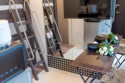 a table with a vase of flowers on it at Space F Yoyogi in Tokyo