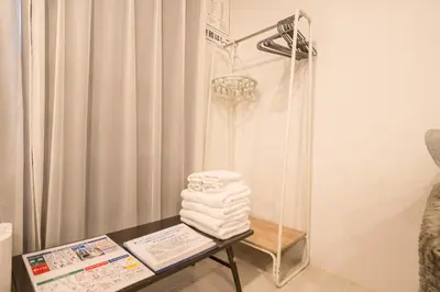 a room with a shower and a table with towels at Space F Yoyogi in Tokyo